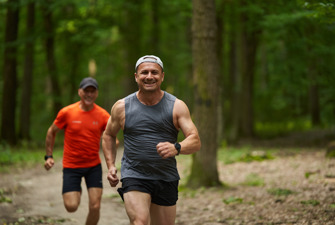 Men running in forest
